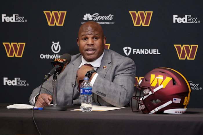 Eric Bieniemy talks to reporters after being introduced as the new offensive coordinator and assistant head coach of the Washington Commanders.
